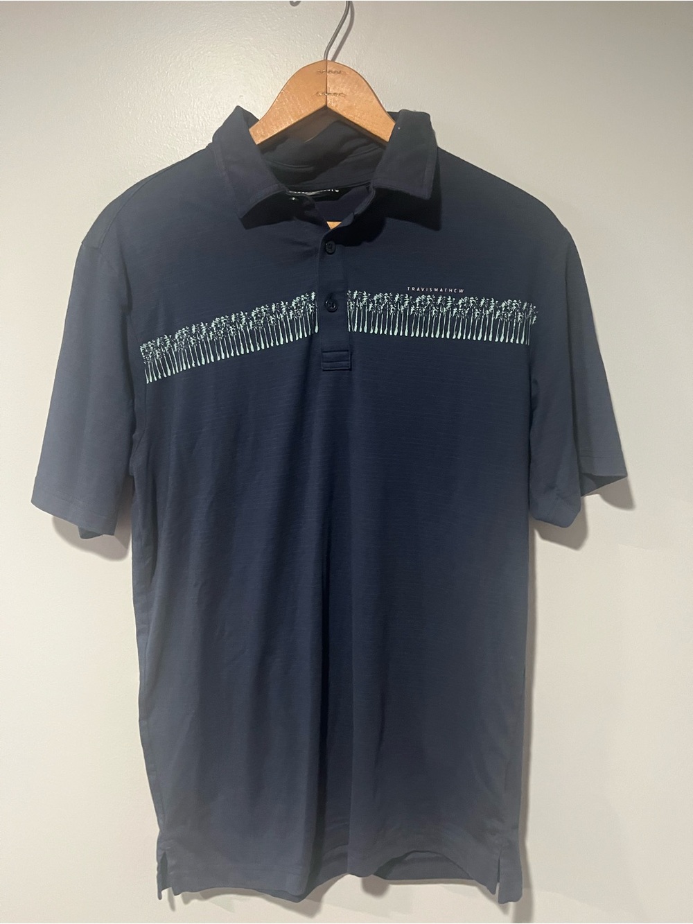 Travis Mathew Navy Polo with Palm Tree Stripe